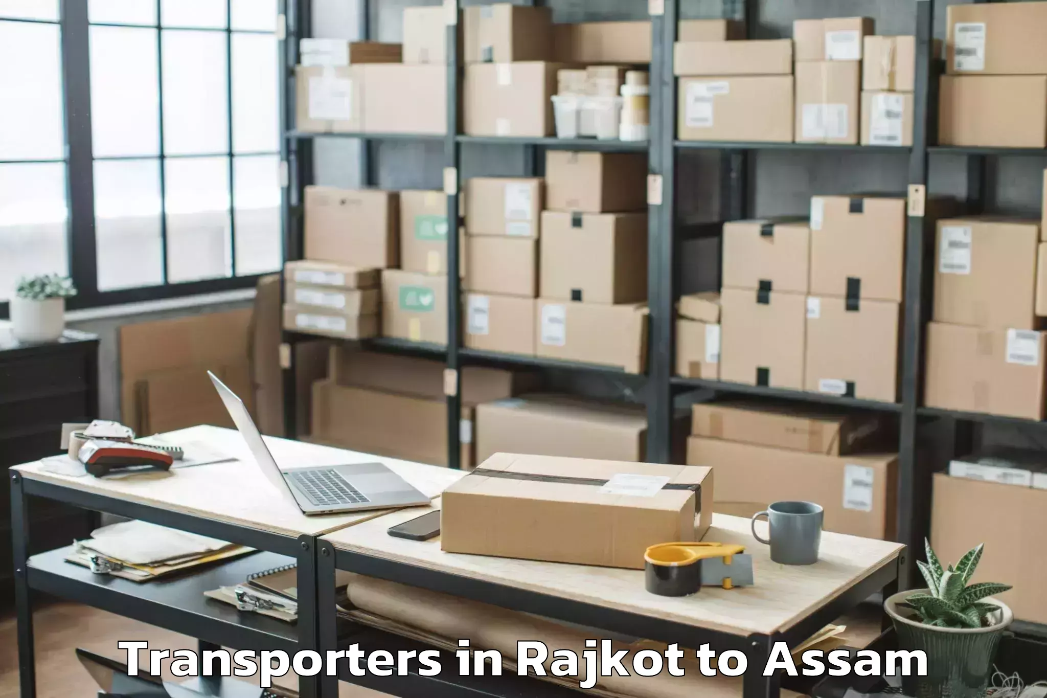 Easy Rajkot to Bokajan Transporters Booking